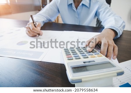 Business woman looking at charts, spreadsheets, graph financial development, bank accounts, statistics, economy, data analysis, investment analysis, stock exchange Royalty-Free Stock Photo #2079558634