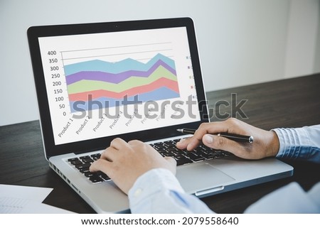 Business woman use on-line via laptop computer for analyzing financial chart, spreadsheets, bank accounts, statistics, economy, data analysis, investment analysis, stock exchange Royalty-Free Stock Photo #2079558640