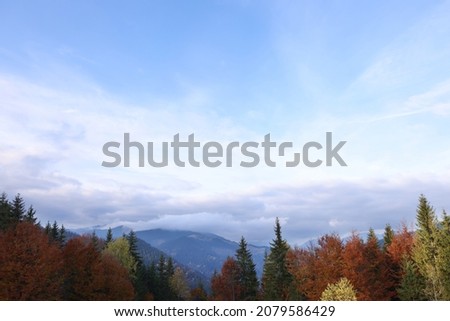 Picturesque view of majestic mountains on cloudy day