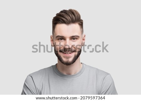 Smiling man studio portrait isolated. People, male beauty,  student, lifestyle concept Royalty-Free Stock Photo #2079597364