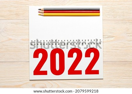 budget 2022 in notepad on wooden table