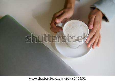 Close up picture of a cup of cappuccino