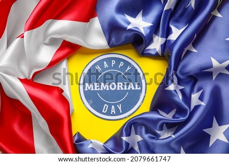Paper sheet with text MEMORIAL DAY and USA flag on color background