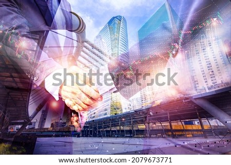 Double exposure picture. Picture mix  building city and businessman is Shake hands show Confident.partnership,deal,leader.Picture concept action man and business.