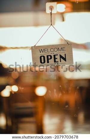 hangging wooden sign sorry we are closed please come back again, background mirror for restaurant or cafe