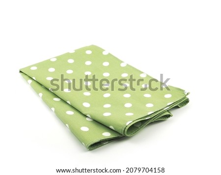White polka dot on green fabric or napkin isolated on white background. Concept kitchen utensils and tableware.
 Royalty-Free Stock Photo #2079704158