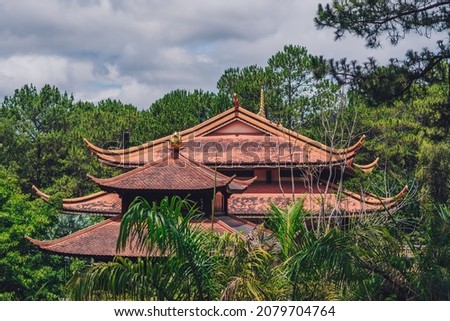 E Antique red brown pagoda multi tiered Curved roof temple buddhist. Pine palm forest day sky cloud nature background. Calm god religious peace quiet relax soul mood. Bright dark tone more in stock