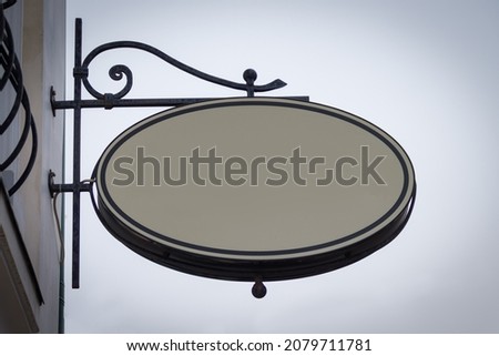 blank round sign board mockup on building wall