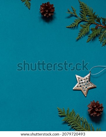 Christmas winter holiday concept frame with festive decorations on thr blue background. Copy space