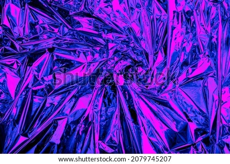 Neon background foil with purple and blue light. Psychedelic abstract gradient texture. Crazy wallpaper. Royalty-Free Stock Photo #2079745207