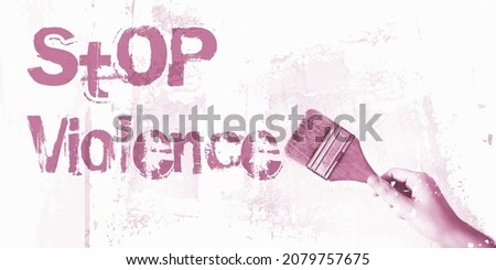 Stop Violence words on wall ,paintbrush. Domestic abuse prevention concept