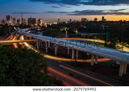 Aerial View of Nairobi Skyline with light trails during sunset