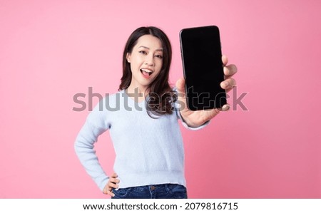 Portrait of a beautiful young Asian girl, isolated on pink background
 Royalty-Free Stock Photo #2079816715