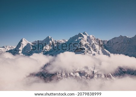 amazing snow covered peaks in the Swiss alps Jungfrau region from Schilthorn Royalty-Free Stock Photo #2079838999