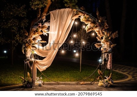 Beautiful wedding arch. Celebrations and greetings Royalty-Free Stock Photo #2079869545