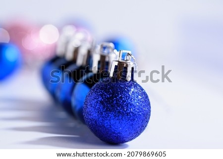 Blue Christmas Baubles on a white background. 