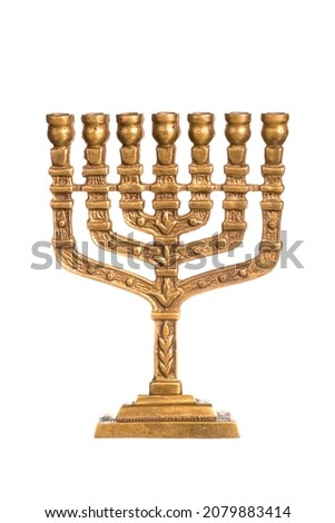 Hanukkah candlestick isolated on white. Ancient ritual candle menorah close up on a white background. Hanukkah festive attribute. Ritual item. The Menorah is the oldest symbol of Judaism.