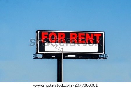 Blank billboard for rent on a busy highway in the USA