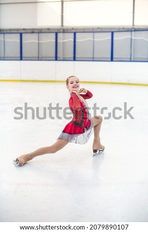 cute girl ice skater skating rink
