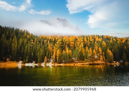 Dramatic image of autumn lake in National Park Tre Cime di Lavaredo. Location place Misurina lake, Auronzo, Dolomiti alps, South Tyrol, Italy, Europe. Photo wallpapers. Discover the beauty of earth.
