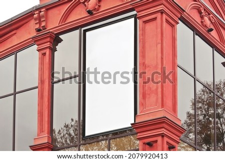 Rectangular sign on the building. Copy space and space for text. Mockup for design. Blank template for advertising. White frame on the facade of the house. Advertising on architecture.