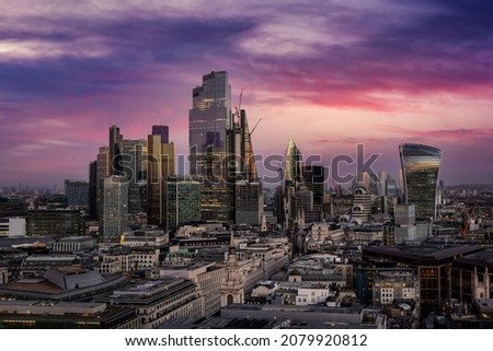 2021 year view of the urban skyline of the City of London during dusk with the completed office skyscrapers reflecting the soft skylight