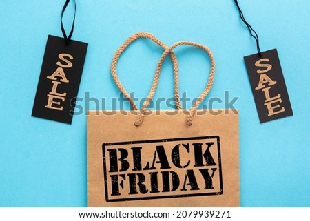 label Sale tag with shopper paper bag, black Friday or cyber monday shopper - online shopping concept
