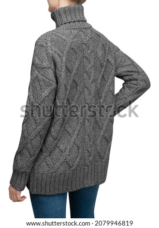 Wool knitted sweater isolated on white. Woman posing in grey knitted sweater.