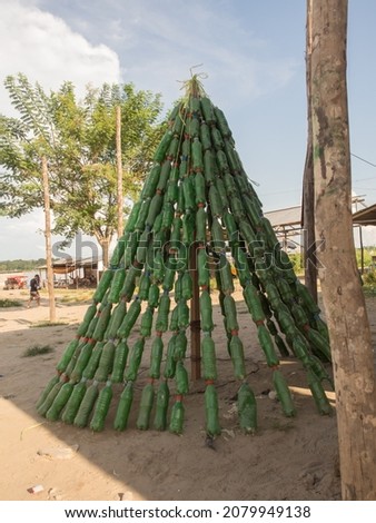 A Christmas tree made from the green bottles waiting for a Christmas time in Santa Rosa, Peru, South America.