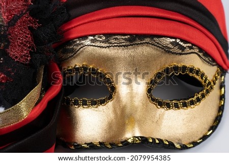 Paris, France - 11 22 2021: Packshot of Masked woman. A colorful Venetian mask with ribbons and glitters