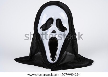 Paris, France - 11 22 2021: Packshot of Masked woman. A black and white scream mask Royalty-Free Stock Photo #2079954394