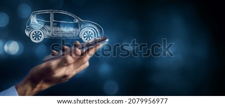 a man presses on the phone on a drawn car