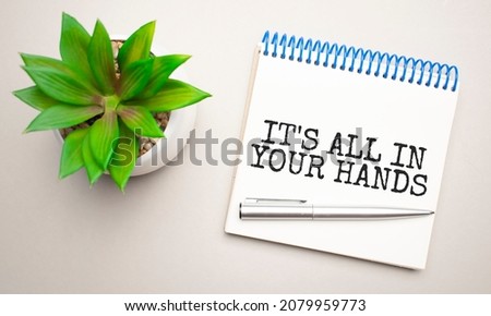 Business ethics is written in a white notepad near a clipboard, calculator, green plant, glasses and a pen on a yellow and concrete background. Business concept. Flat lay.