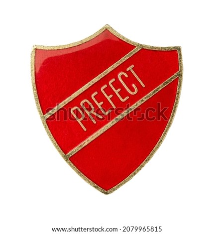 An Isolated Shield Shaped Prefect Badge From A British School On A White Background Royalty-Free Stock Photo #2079965815