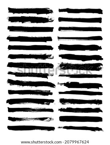 Collection of black brush strokes on a white background Royalty-Free Stock Photo #2079967624