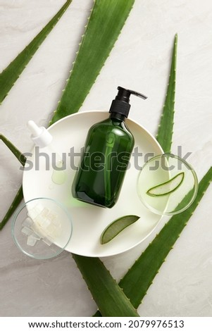 Aloe vera extract research in laboratory with a petri dish dropper and cosmetic jar template in white background for aloe vera research advertising , photography science content