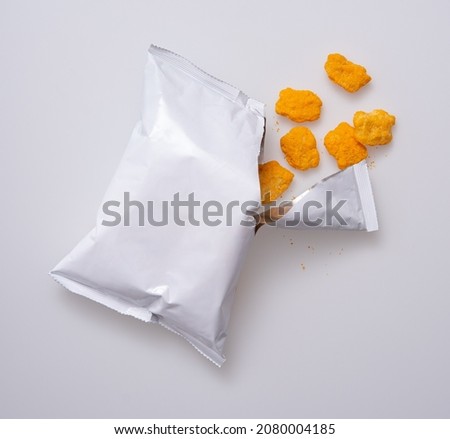 Corn puff snacks open bag packaging isolated on white background Royalty-Free Stock Photo #2080004185