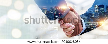 negotiation. double exposure image of investor business man handshake with partner for successful meeting deal with during sunrise and cityscape background, investment, partnership, teamwork concept