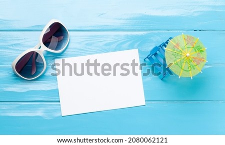 Travel and vacation concept. Sunglasses and blank card for your text or photo