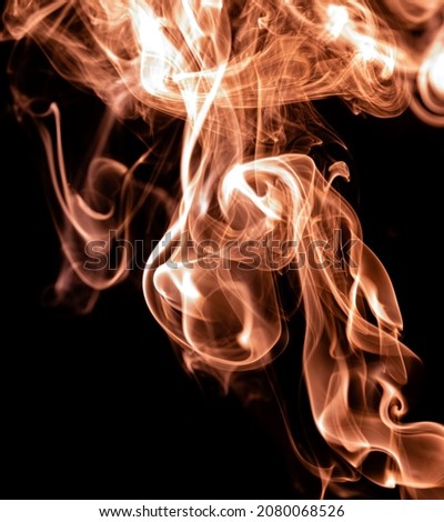 Orange color abstract smoke on black background