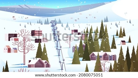 cableway in snowy mountains residential houses area ski resort christmas new year holidays celebration winter