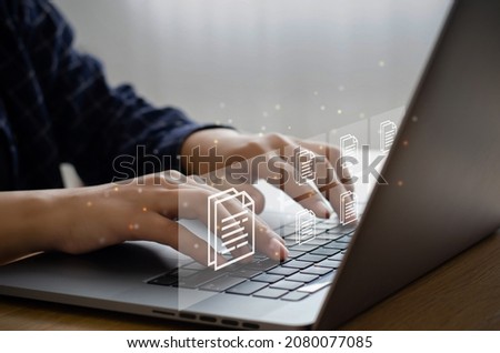 business man who uses a computer to manage documents document management concept digital document online document database and digital file storage systems, record-keeping software database technology Royalty-Free Stock Photo #2080077085