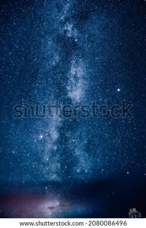 The night sky milky way galaxy with billions of sparkling stars in cosmic space in the evening.