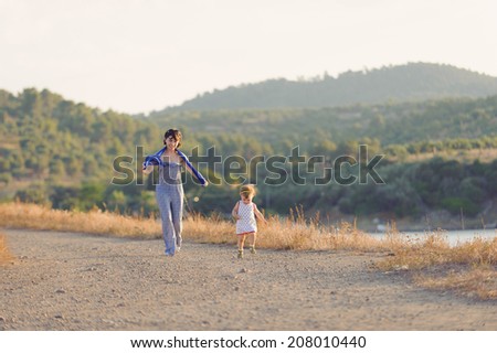 mother following her running child