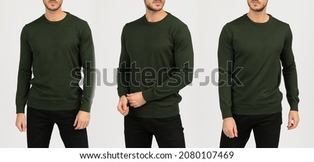 Man in a green sweatshirt on a white background. Template of a green sweater.
 Royalty-Free Stock Photo #2080107469