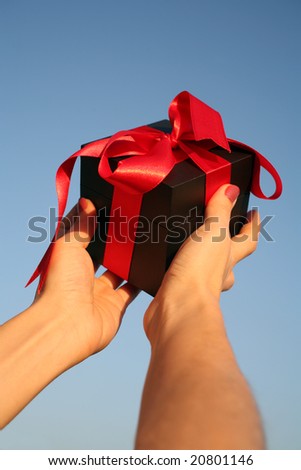 close up shot of black giftbox in hand