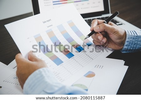 Business woman looking at charts, spreadsheets, graph financial development, bank accounts, statistics, economy, data analysis, investment analysis, stock exchange Royalty-Free Stock Photo #2080115887