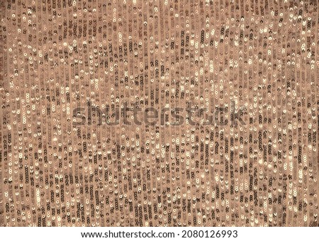 Glittery sparkling festive background - photo of golden sequined fabric. Royalty-Free Stock Photo #2080126993