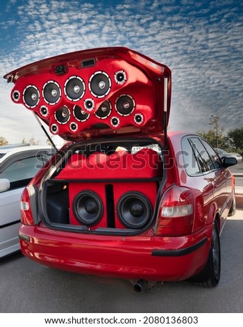 Car sounds system on a red car. Royalty-Free Stock Photo #2080136803