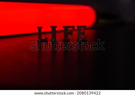 Life text with red and dark background